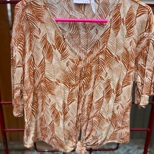 Brown, tan and cream colored blouse.